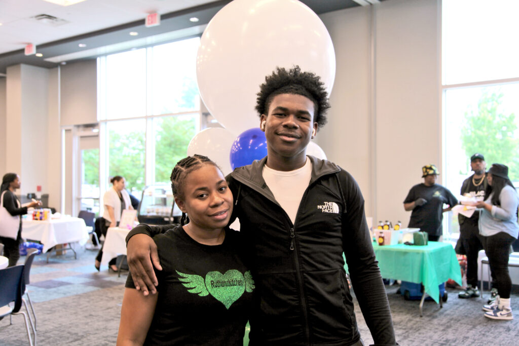 Aisha and Amir Burnett sold soulful dinners at the event; Amir provided the balloon decorations 